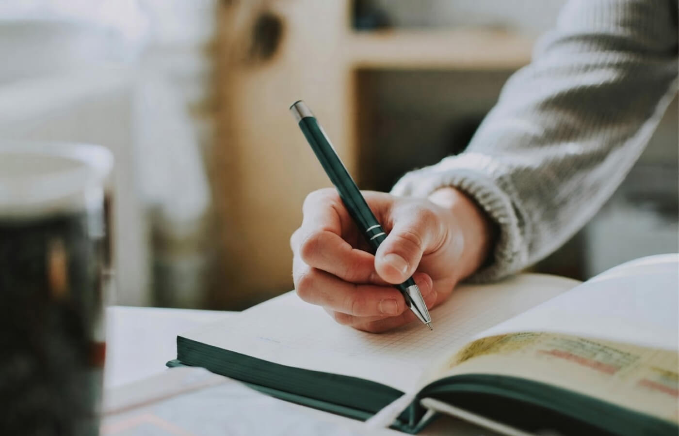 Person writing in journal