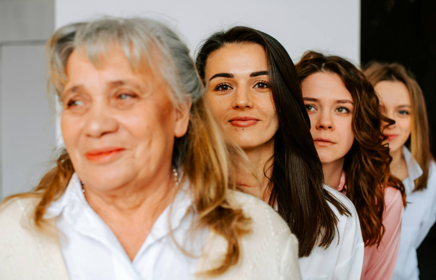 Group of women standing together of all ages