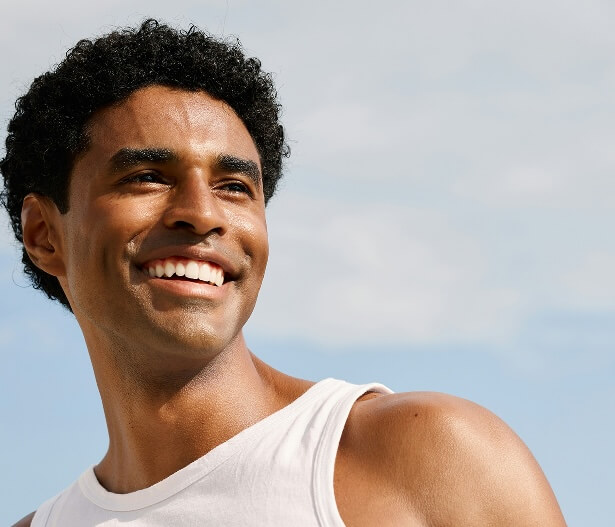 Man smiling outdoors